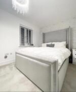 Winged Headboard Ottoman Bed